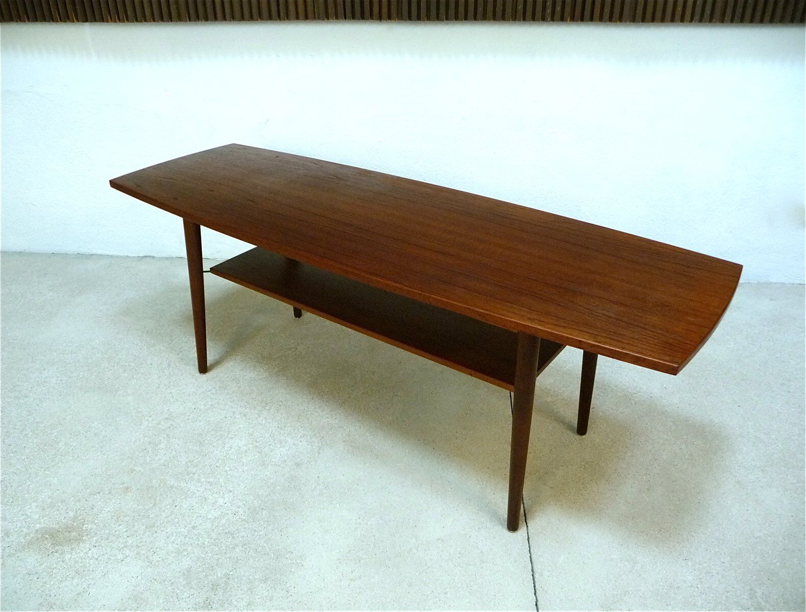 Curved Danish teak coffee table with additional shelf compartment, 1960s