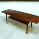Curved Danish teak coffee table with additional shelf compartment, 1960s