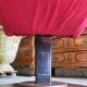 Old cinema chair with a red reclining seat.