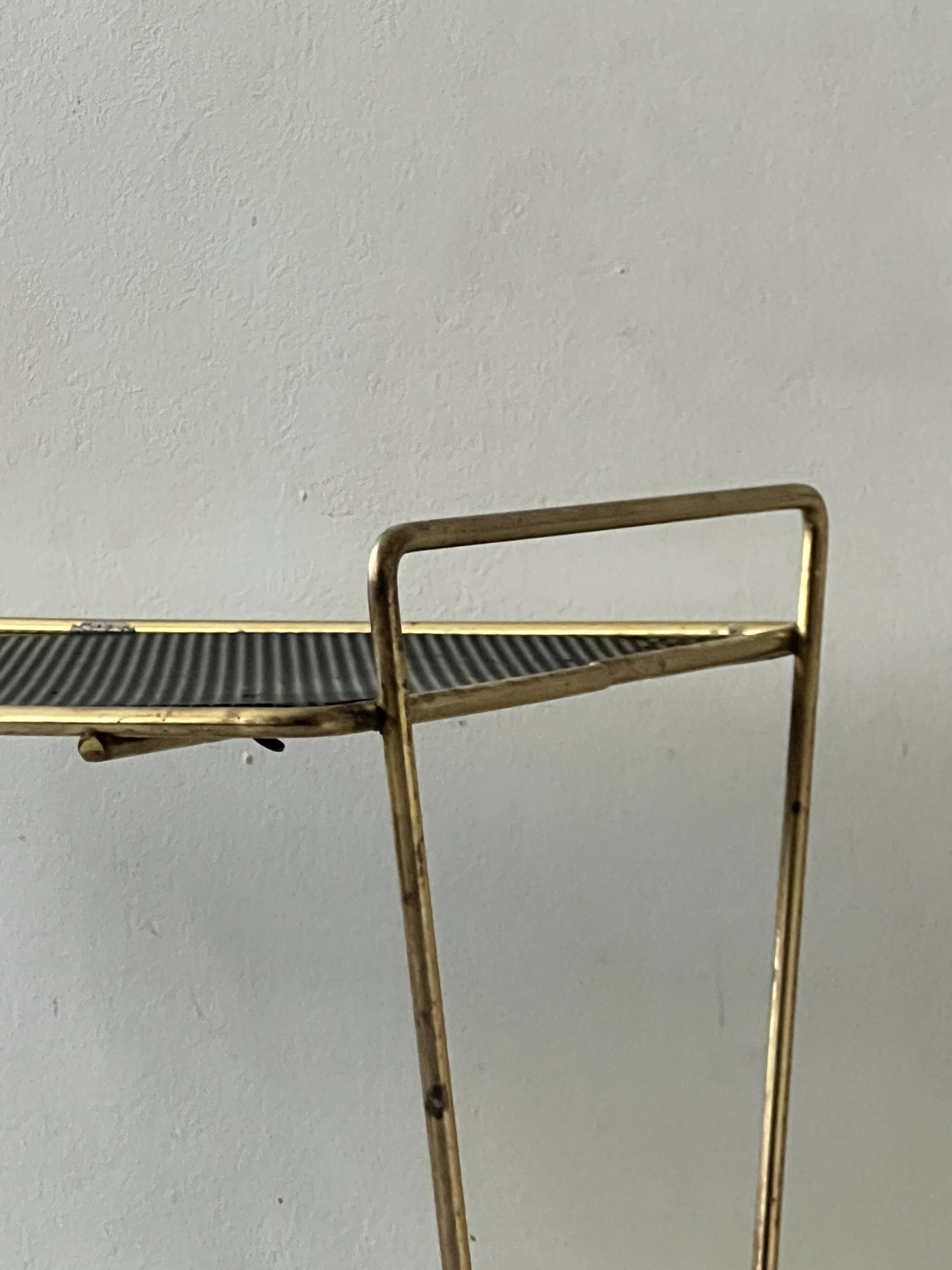 Side table - perforated metal magazine rack, designed by Matégot