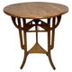 Round Art Nouveau coffee table with a sculpted top.