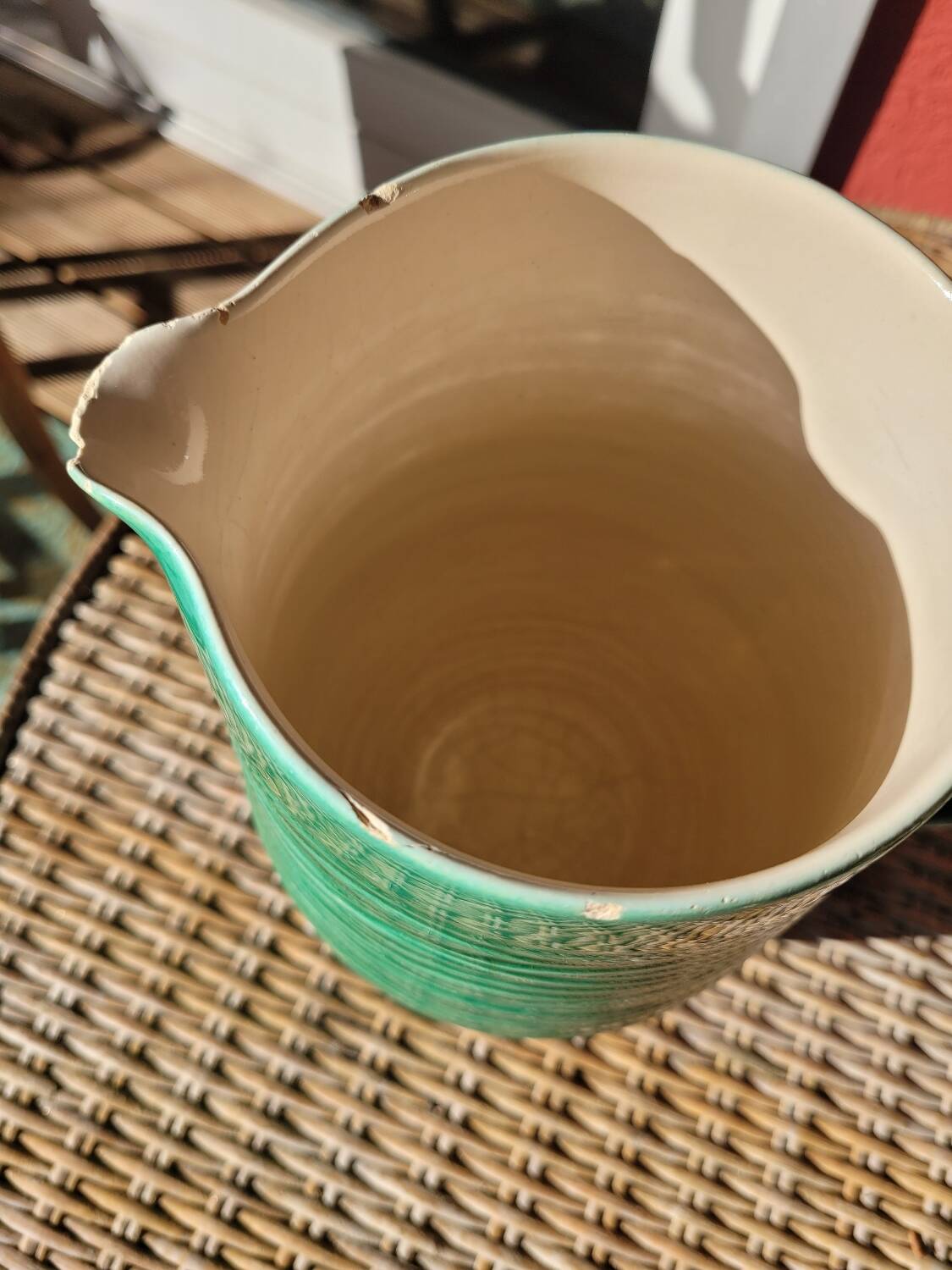 Green glazed ceramic pitcher