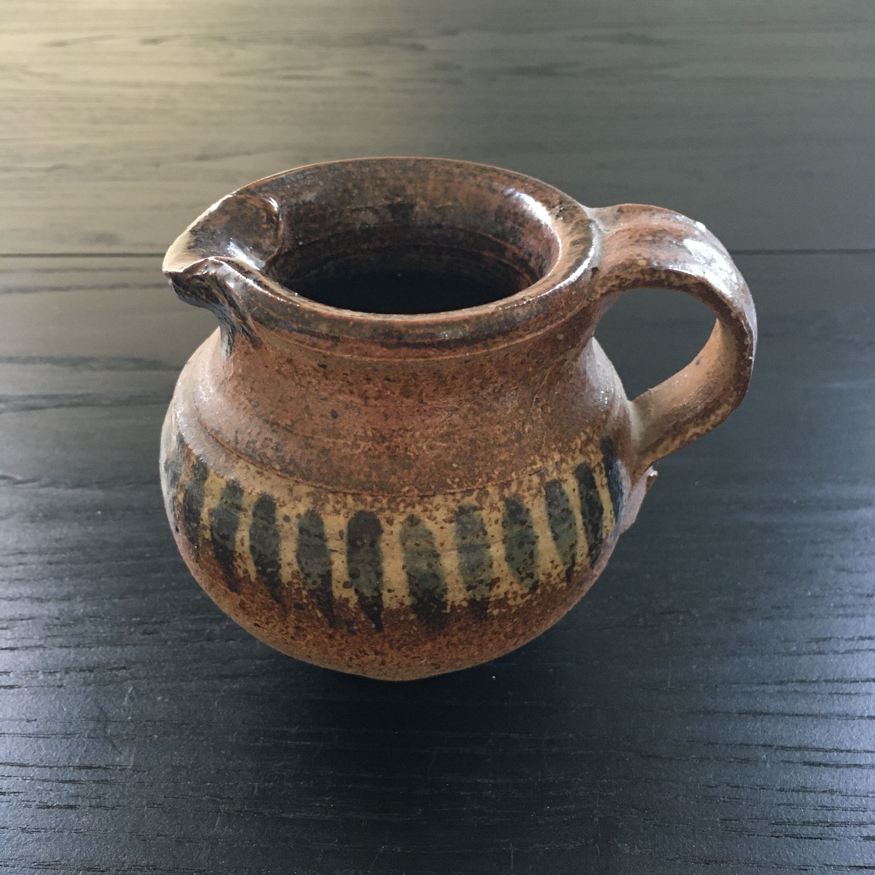 Stoneware pitcher with striped decoration