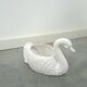 vintage porcelain flower pot in the shape of a swan