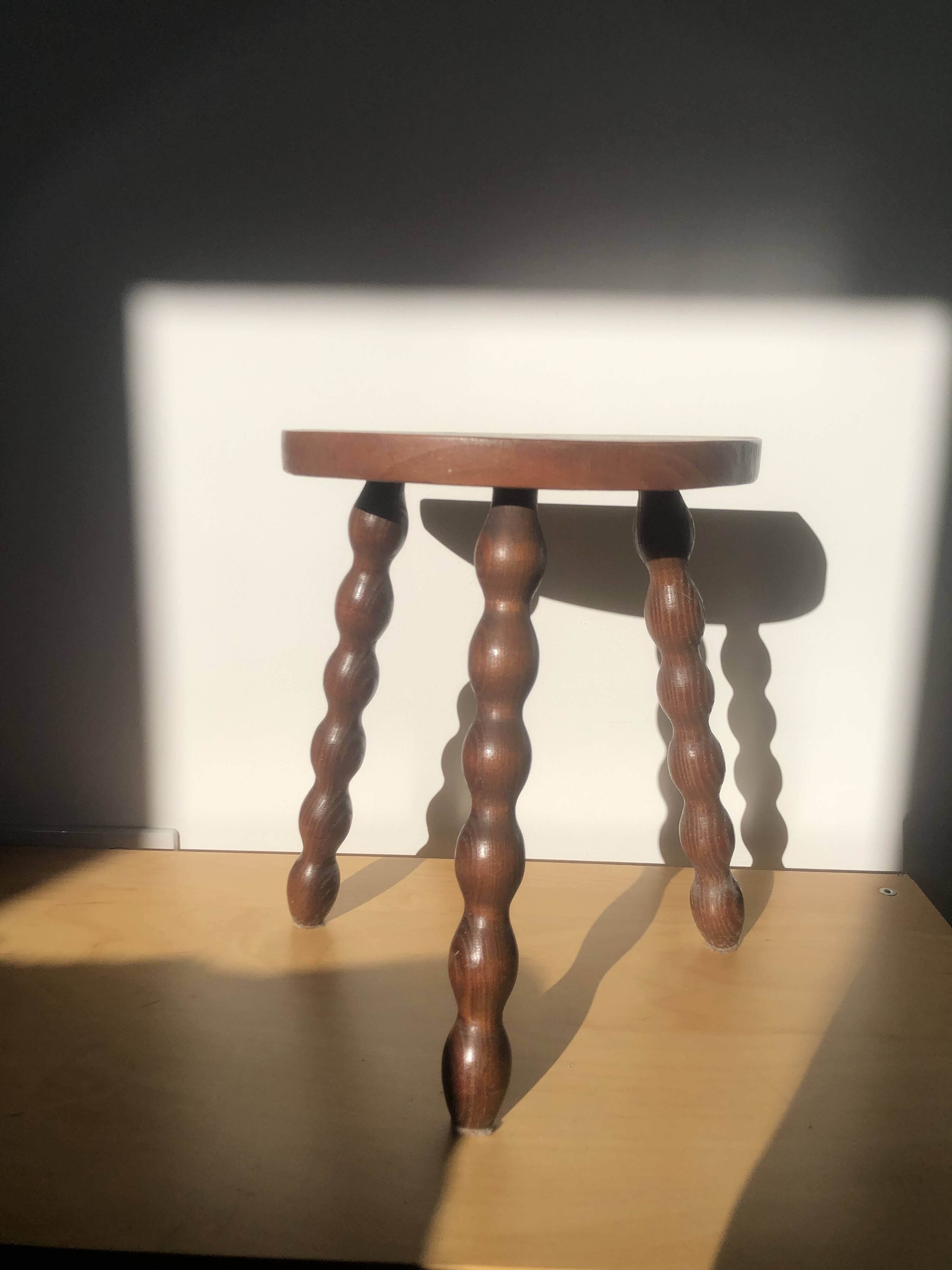 Turned wooden tripod stool