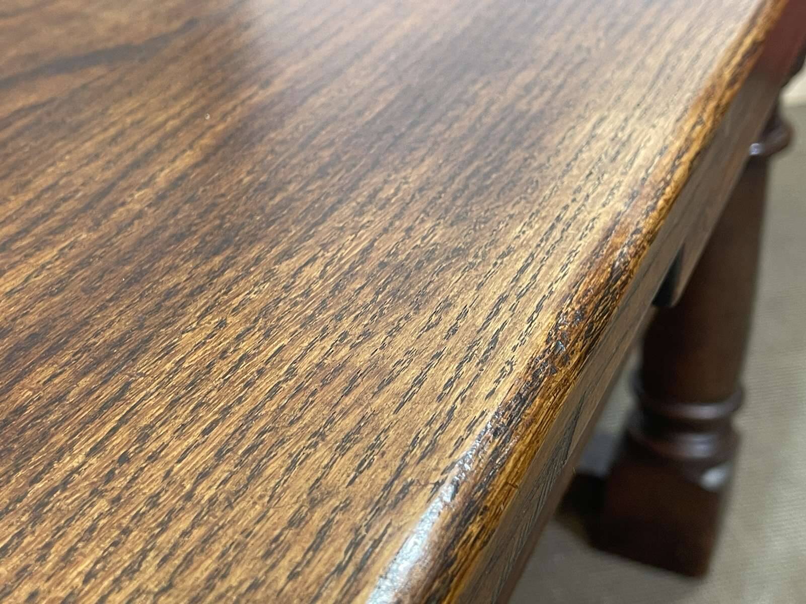 English monastery table with extensions from the late 19th century in elm and oak.