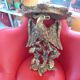 Golden wall shelf, eagle motif