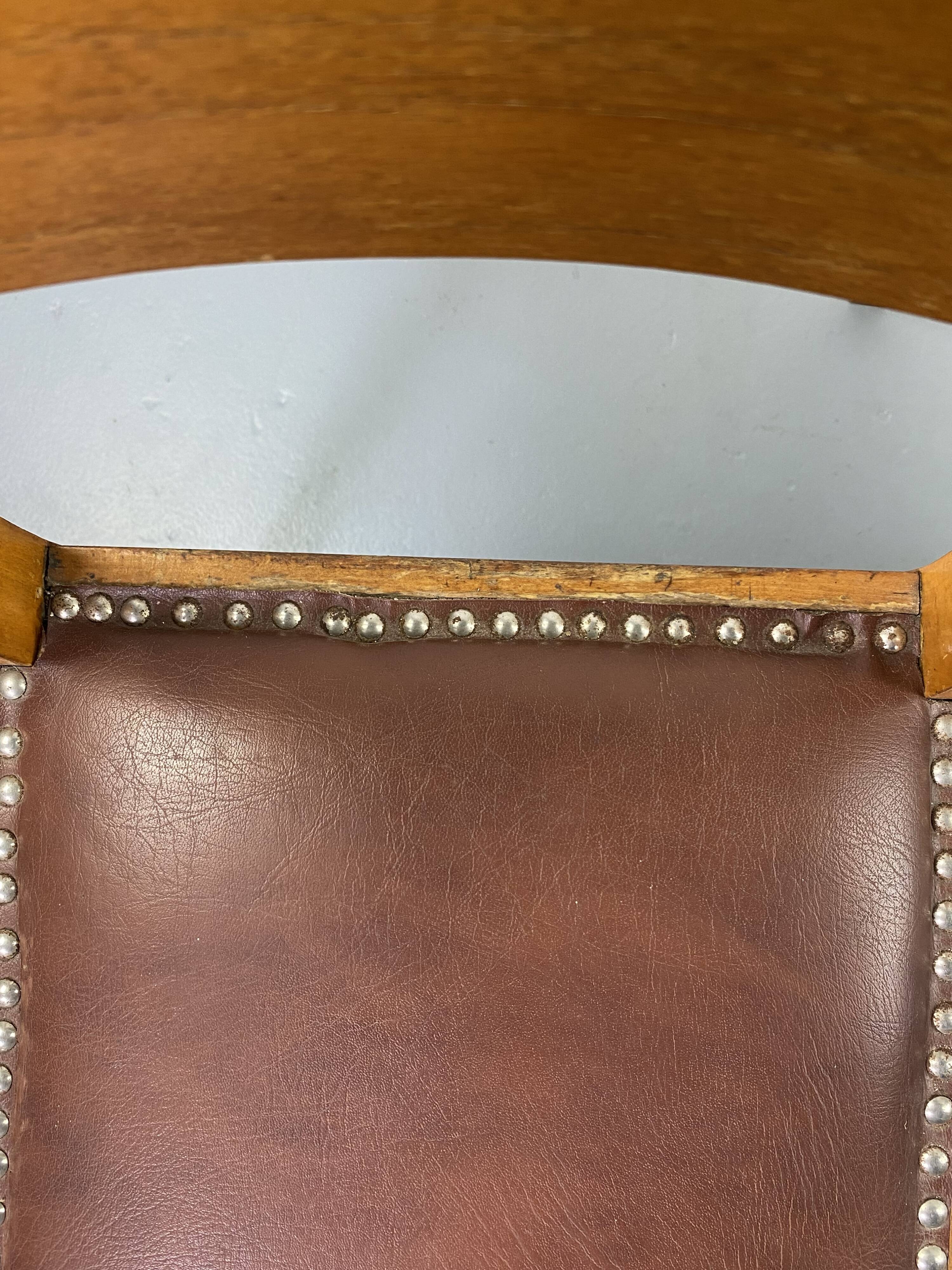 Pair of wooden and leather chairs