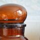 Amber vintage glass apothecary pot, cabochon lid