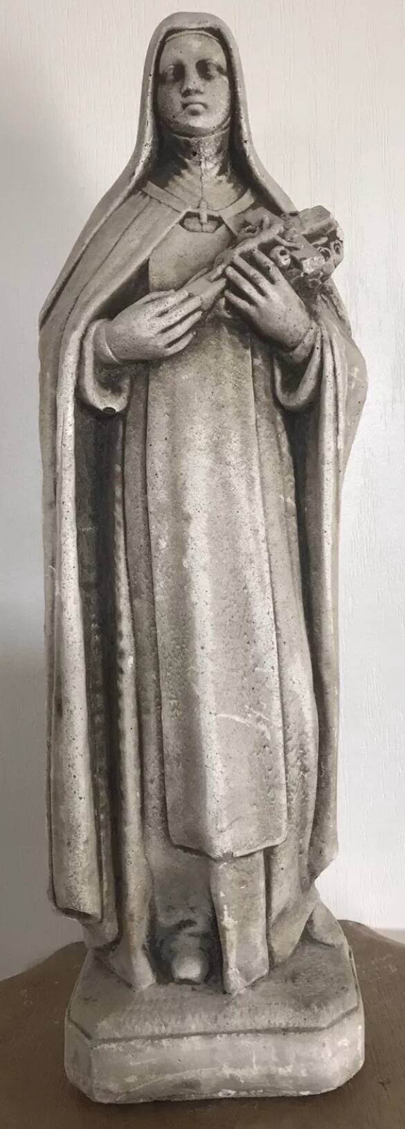 Religious statue of sainte therese of lisieux “the little flower of jesus” in stone