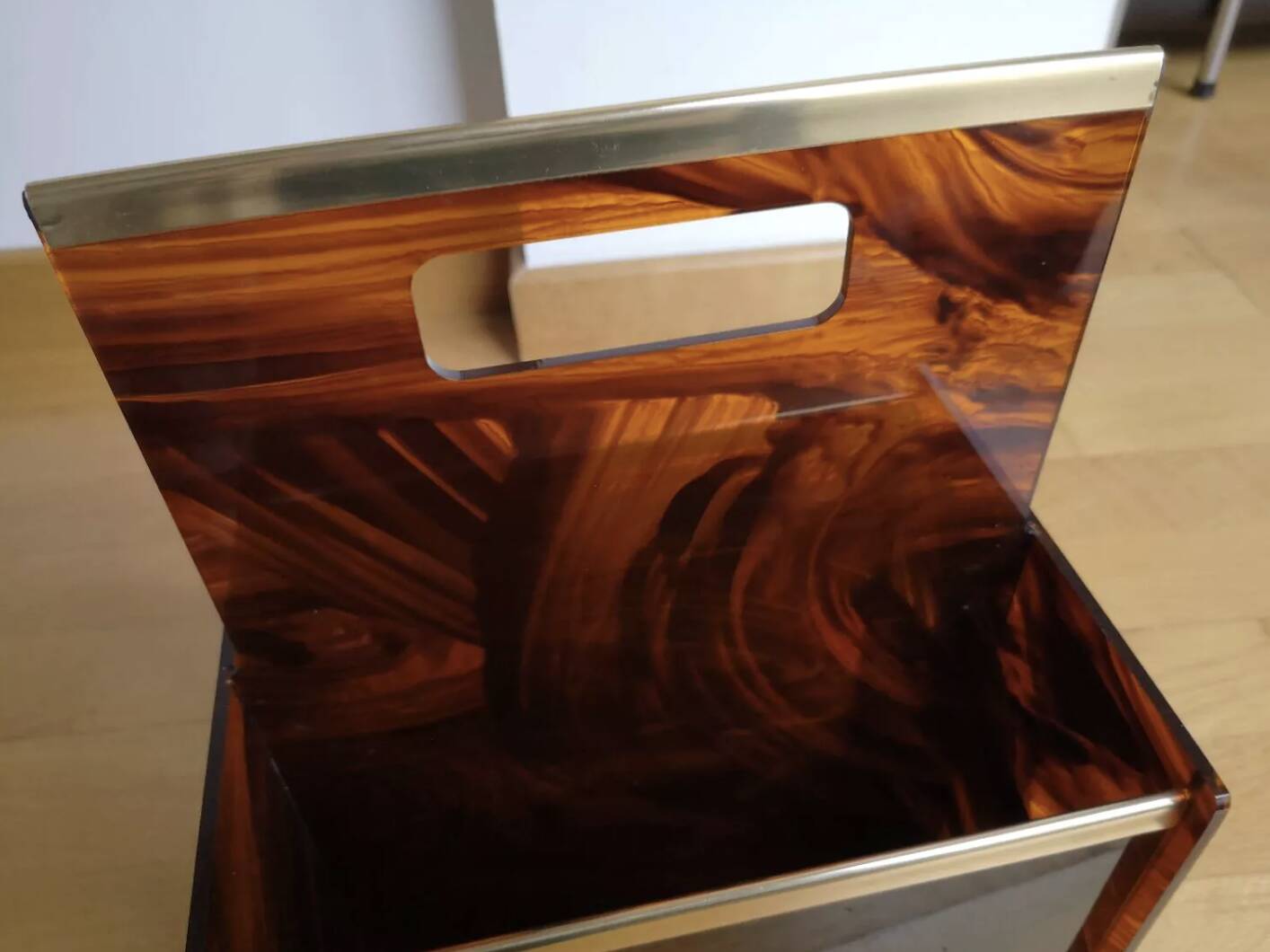 Tortoiseshell lucite magazine rack from the Christian Dior Home collection.