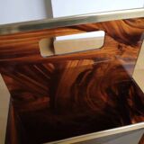 Tortoiseshell lucite magazine rack from the Christian Dior Home collection.