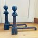 Pair of massive antique-style fire dogs in solid iron from the 20th century.