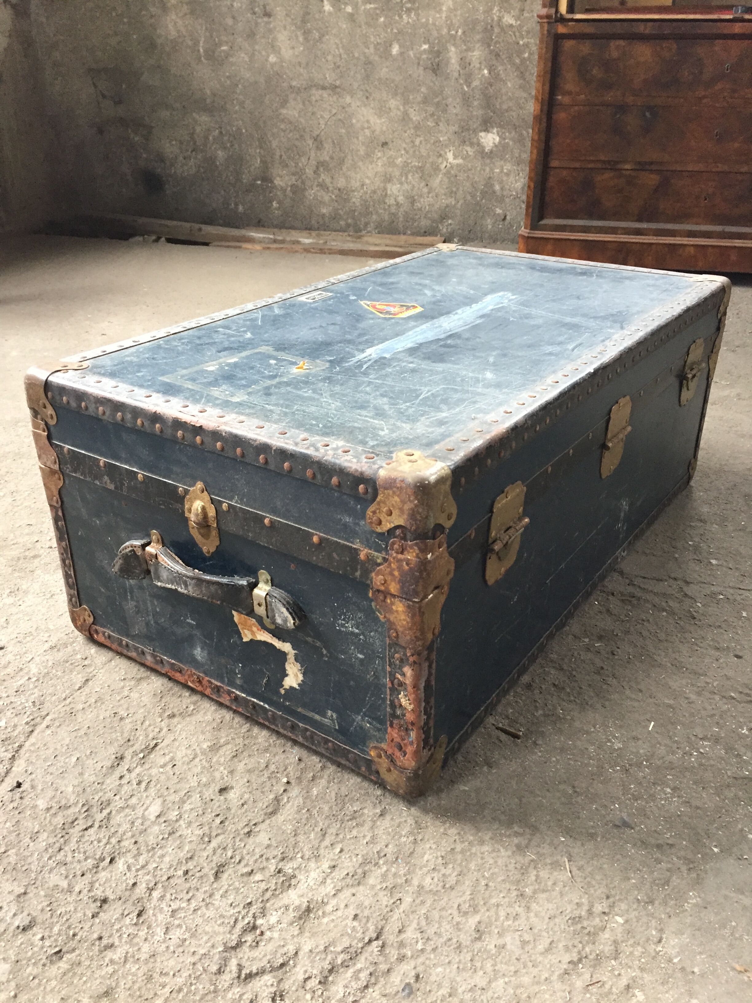 Large blue travel trunk