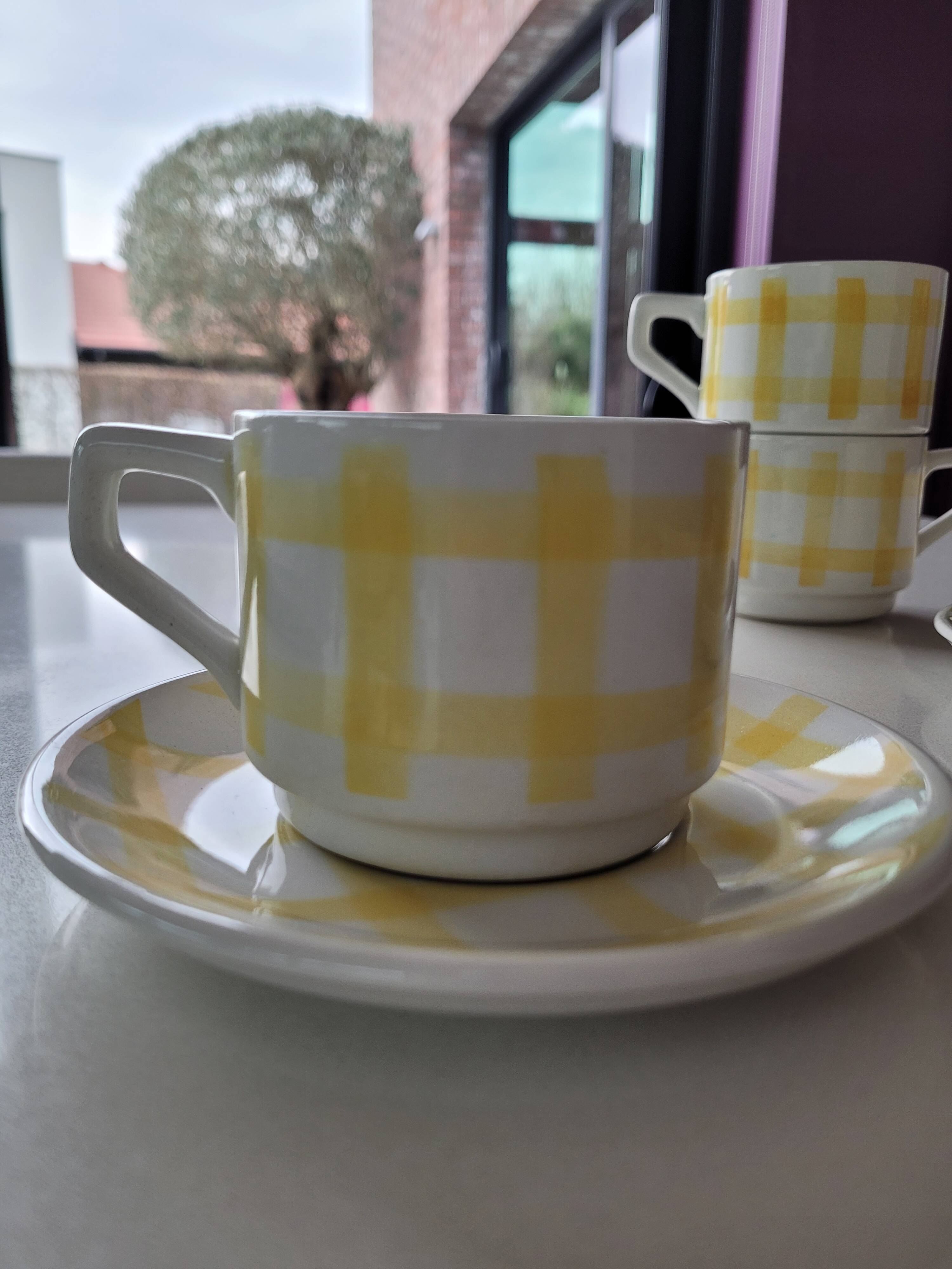 4 cups, 2 under cups yellow and white tea towel pattern