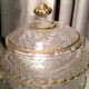 Butter dish or candy dish in pressed glass molded with golden rim