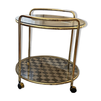 Vintage gold glass table on wheels