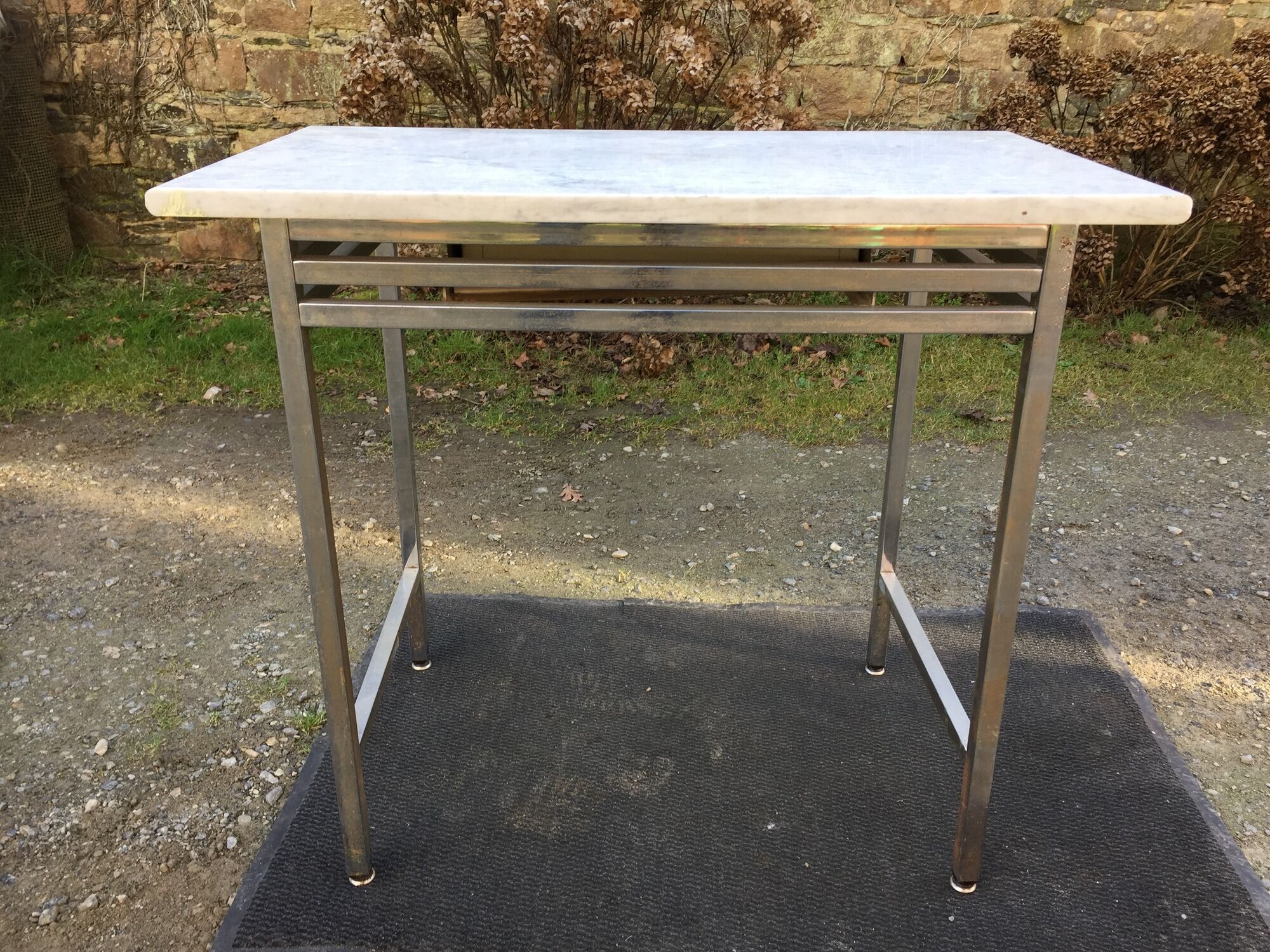 Vintage table with square chrome tubular metal base and marble top with 1 drawer.
