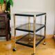 Side table in gold metal and smoked glasses 1970s