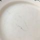 Round serving dish from the Longchamp earthenware factory, Doria model. Iron Land