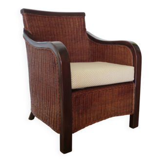 Vintage colonial-style armchair in woven rattan and exotic wood