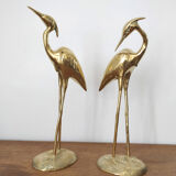 Couple large herons in polished golden brass