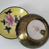 Pair of vintage Chinese decorative plates with floral decoration on a yellow background