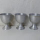 3 old aluminum shells