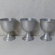 3 old aluminum shells
