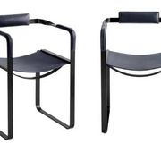 Pair of wanderlust armchairs in black and black metal.