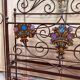 Venetian bed in iron and cast iron from the Art Nouveau period with polychrome decorations
