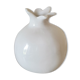 White ceramic vase in the shape of a pomegranate