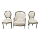 Armchair and 2 chairs set in Louis XVI style, light fabric, patinated wood.