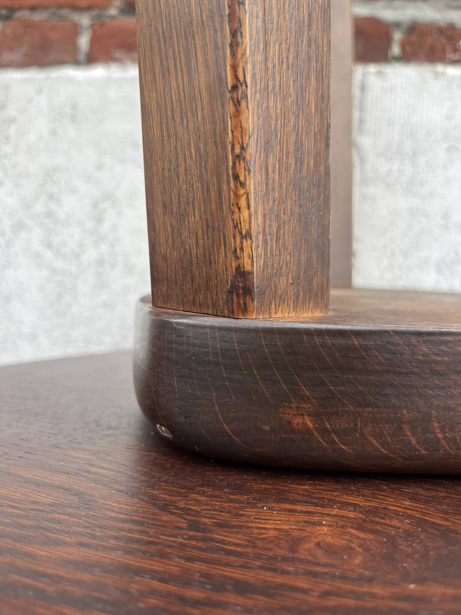 Nested tripod tables made of solid wood, in a modernist brutalist style.