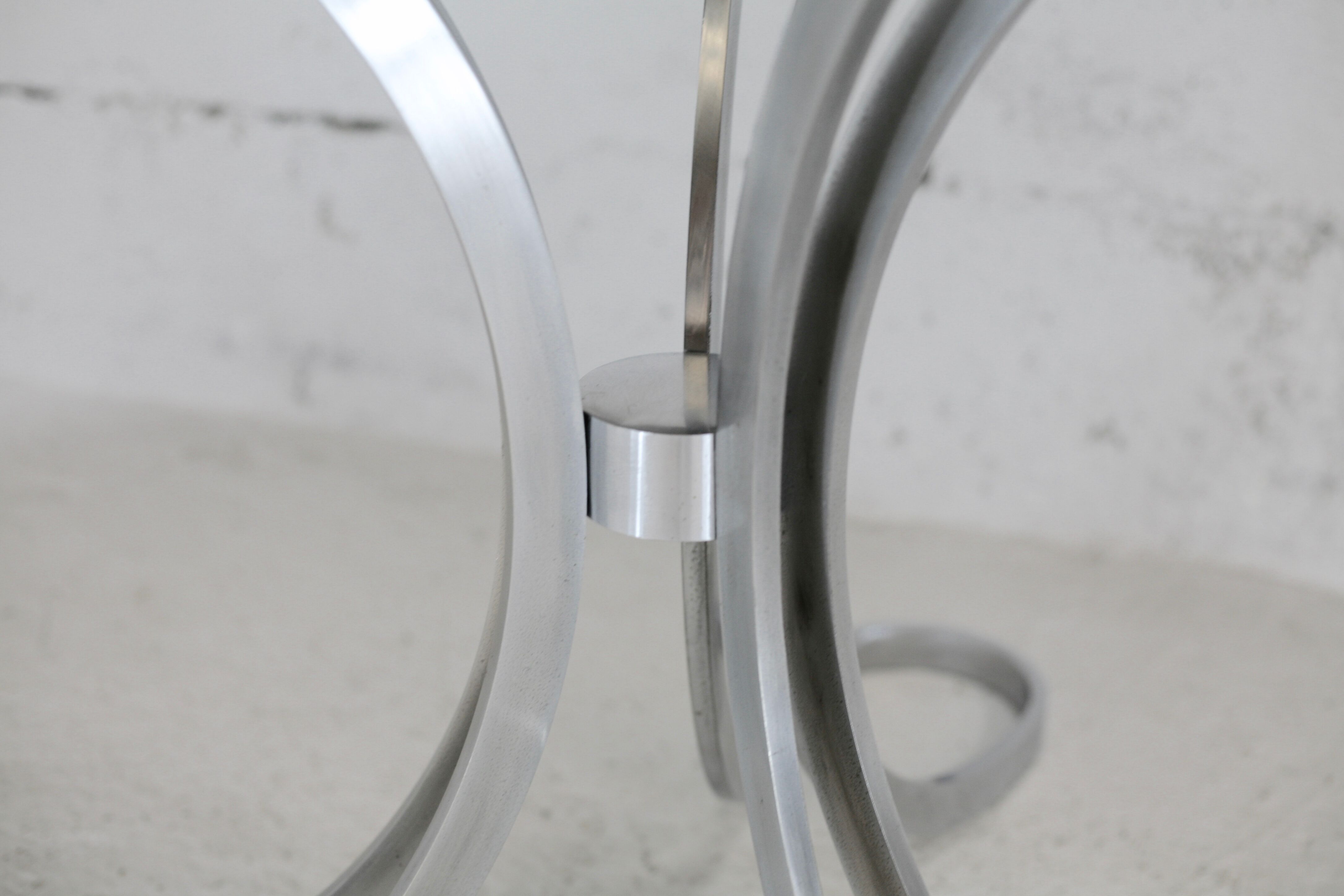 Living room table "Space Age" polished steel, circular slab smoked glass. France, circa 1970.