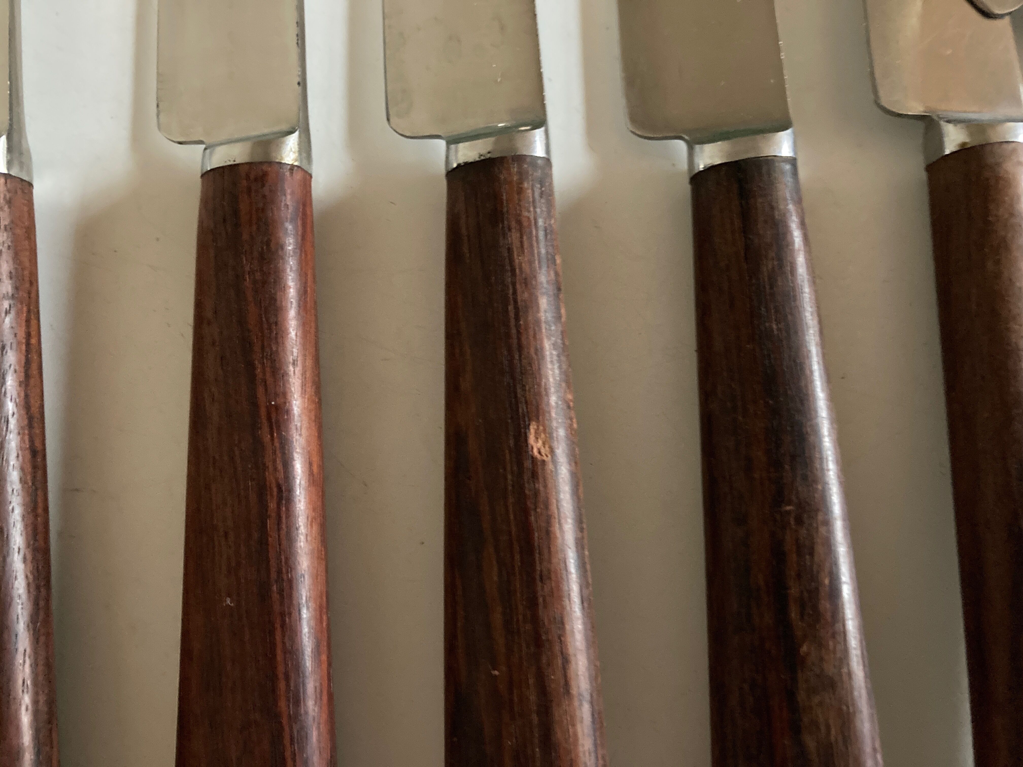 Set of 9 knives with mid century rosewood handle
