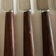 Set de 9 couteaux à manche de bois de palissandre mid century