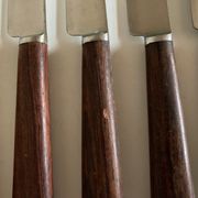 Set de 9 couteaux à manche de bois de palissandre mid century