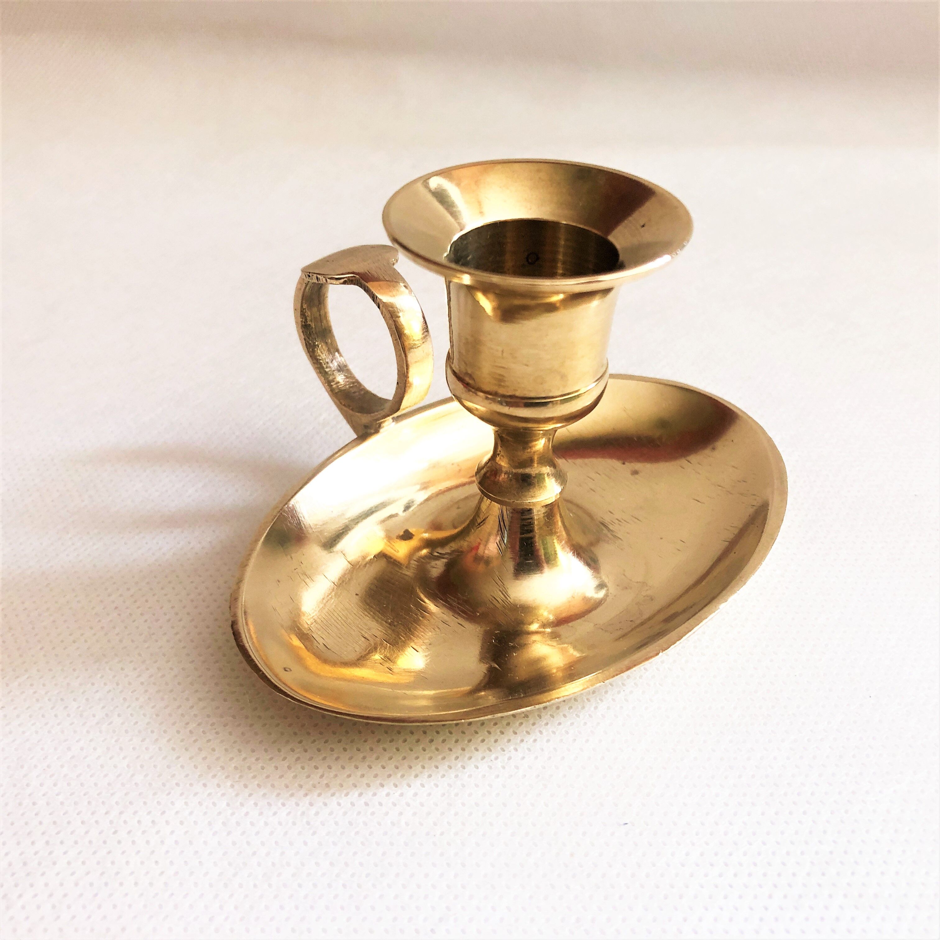Brass oval hand candle holder