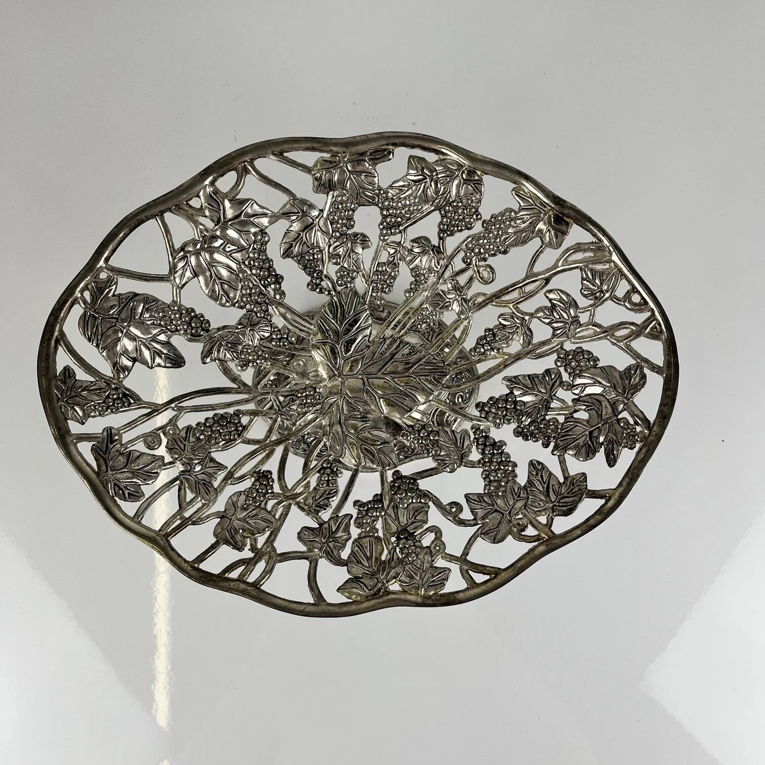 Openwork metal bowl with vine leaf and grape motif, 20th century