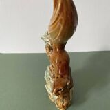 Ceramic squirrel on branch