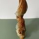 Ceramic squirrel on branch