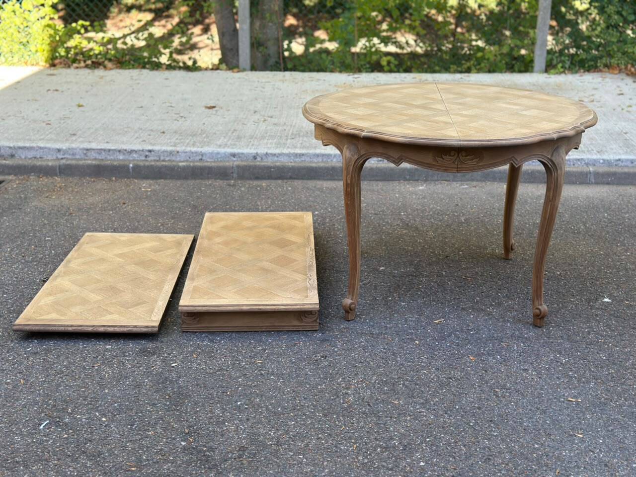Round extendable dining table Louis XV stripped in solid oak 1950