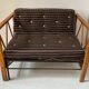 Two-seater bench convertible into a single bed.