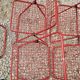 Set of 5 vintage red metal mesh folding chairs, Ted Net style.