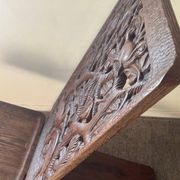 Chaise vintage à palabre en bois sculpté
