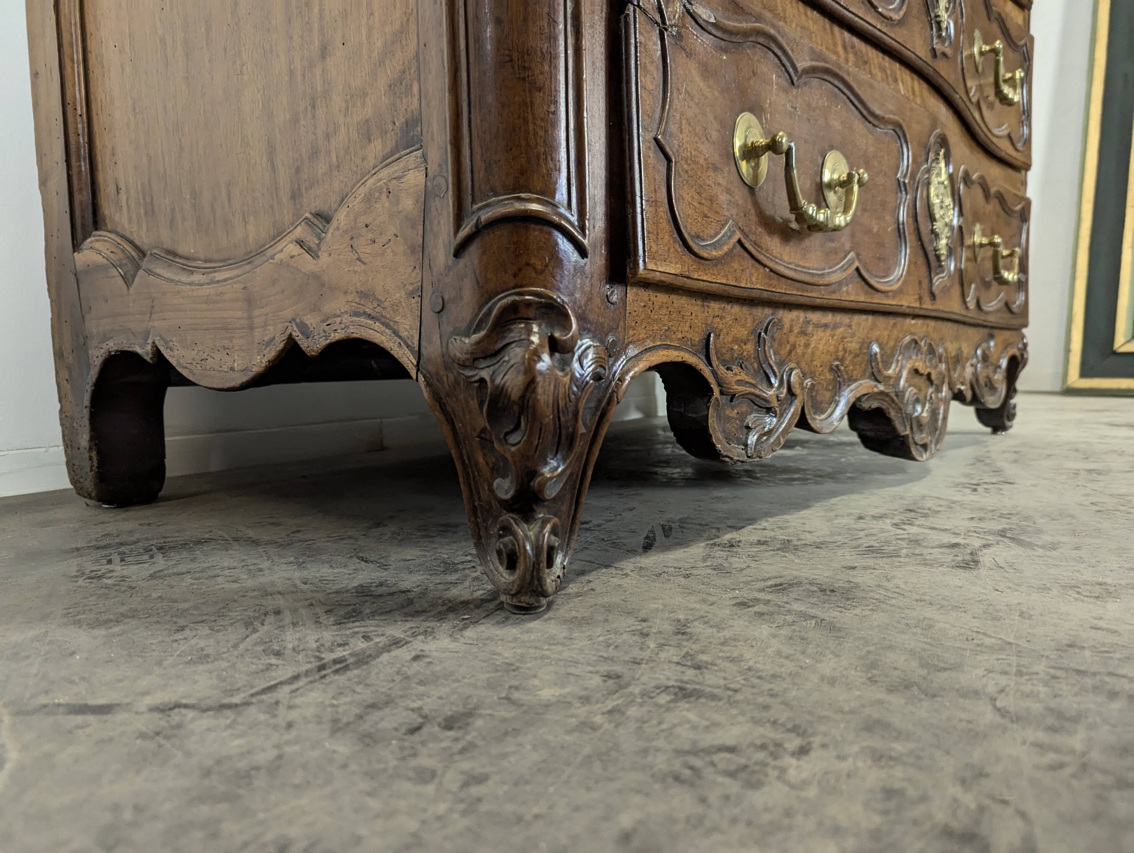 18th century Lyonnaise chest of drawers in carved walnut and bronze