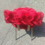 Red furry chairs and pouffe