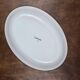 Oval dish decorated with hand-painted blue fish, Mediterranean style