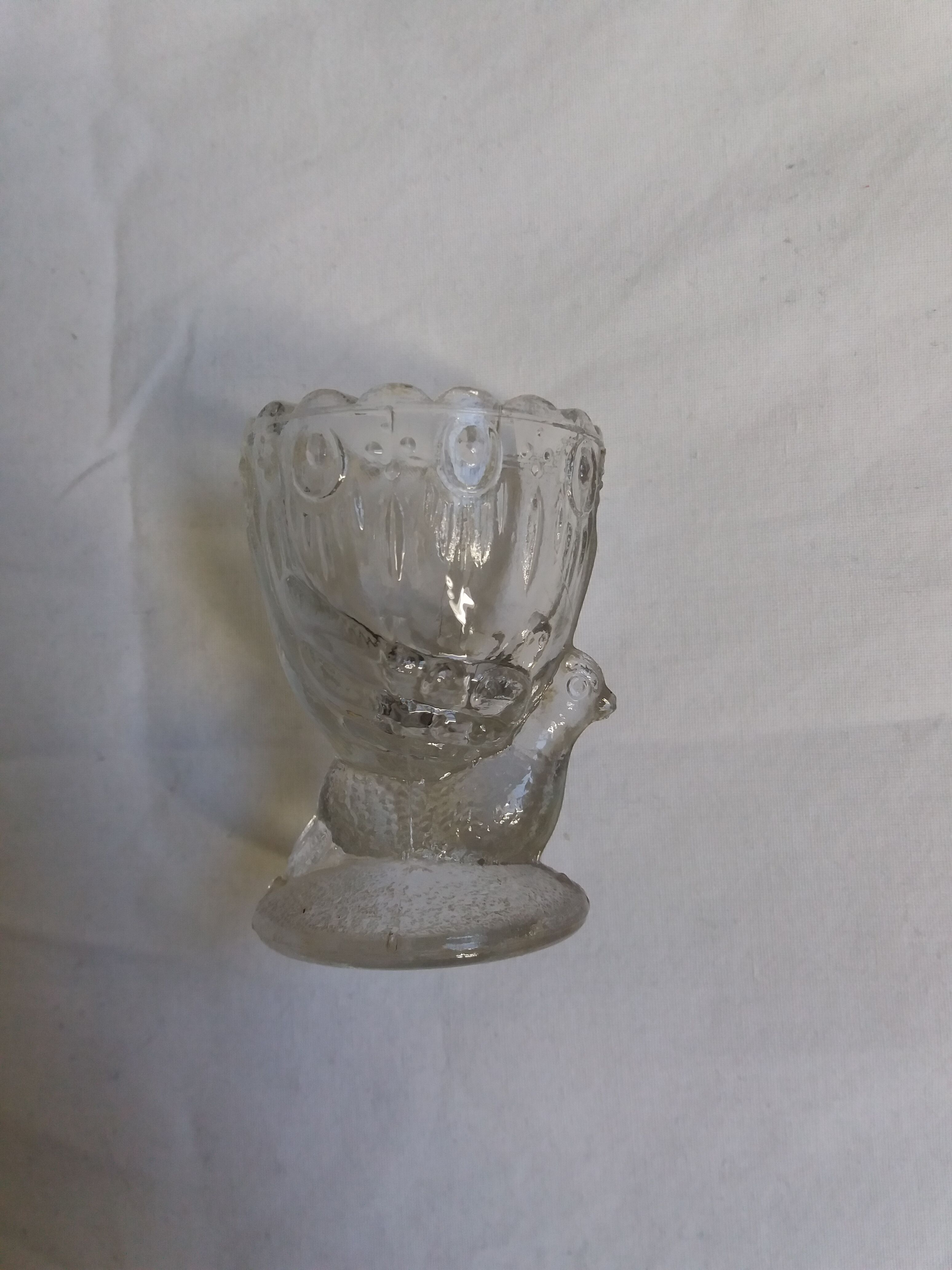 Molded glass egg cup with pigeon bird